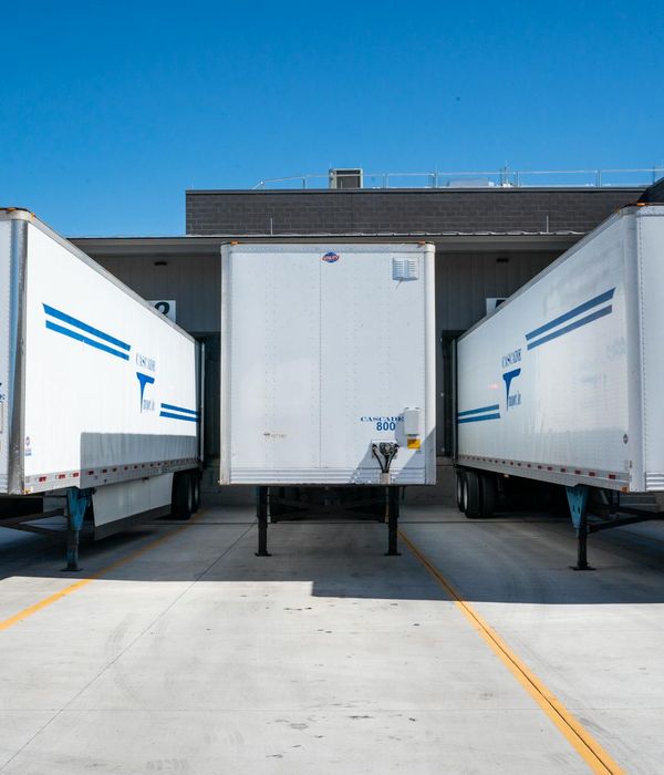 Distribution center with multiple loading docks and delivery trucks