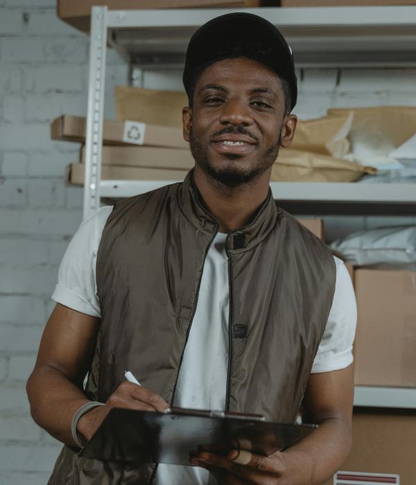 Warehouse manager coordinating retail distribution with delivery fleet